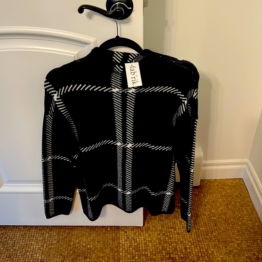 Fabrik sweater with tag on